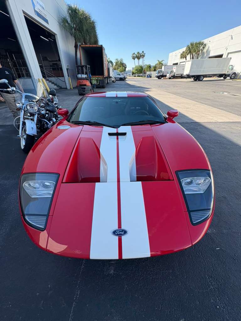 Red Ford GT staged for international vehicle export by air or ocean